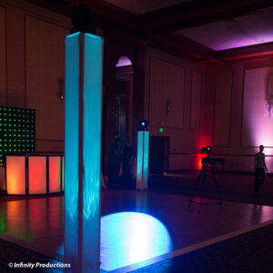 A large room with a stage and lighting.