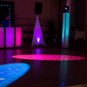 A dj is playing music at a party.