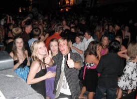 A group of people at a party giving thumbs up.