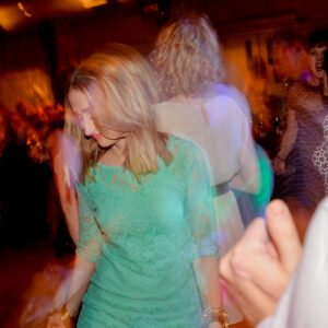 A group of people dancing at a party.
