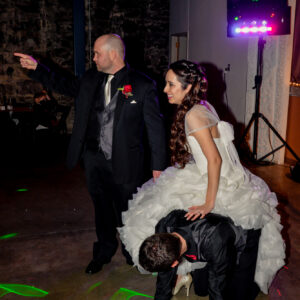 A man in a wedding dress and a woman in a wedding dress.