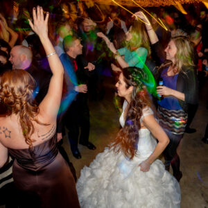A bride and groom dancing at a wedding reception.