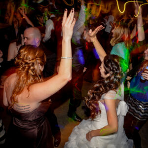 A bride and groom dancing at a wedding reception.