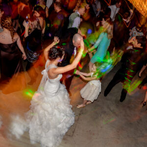 A bride and groom dancing at a wedding reception.
