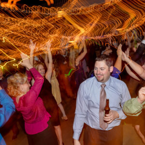 A group of people dancing at a party.