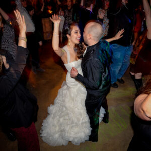 A bride and groom dancing at a wedding reception.