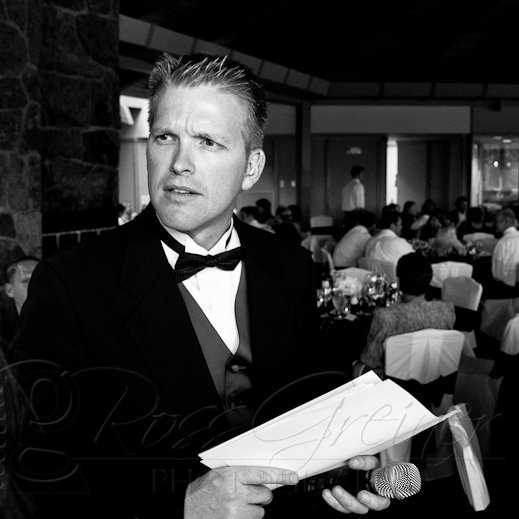 John Murray, a man in a tuxedo, holding a piece of paper.