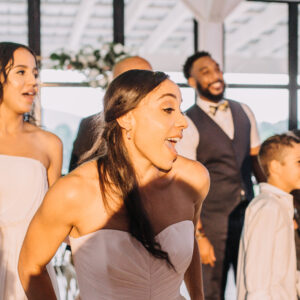 A bride and groom dancing at a wedding reception.