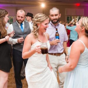 A bride and groom dancing at a wedding reception.