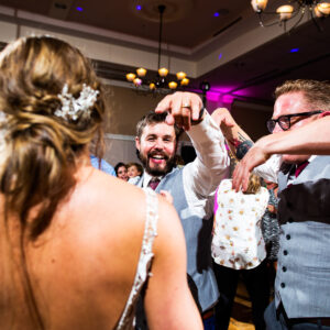 A bride and groom dancing at a wedding reception.