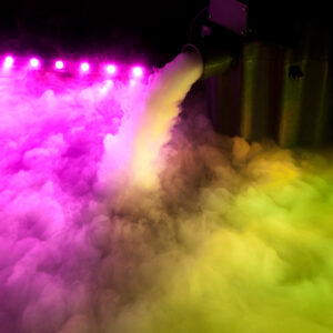 A DJ equipment is creating a vibrant display of rainbow colored smoke.