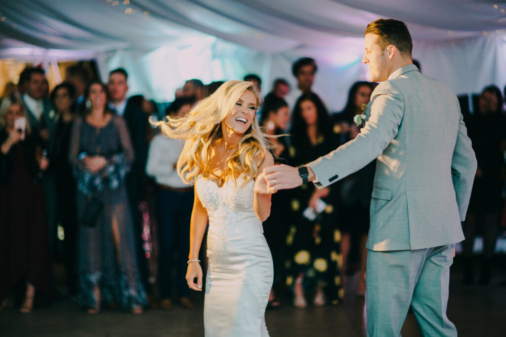 A bride and groom dancing at their wedding reception, with a Georgia wedding DJ setting the perfect mood.