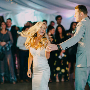 A bride and groom dancing at their wedding reception with a Georgia wedding DJ playing their favorite tunes.