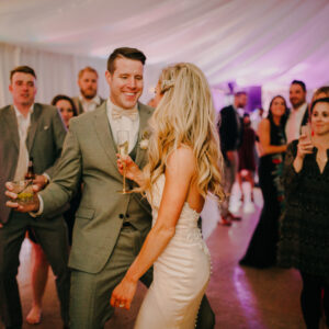 A bride and groom dancing at their Georgia wedding reception, entertained by a professional DJ service.
