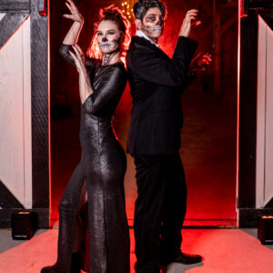 A man and a woman dressed up for Halloween, ready to add fun to the night with a DJ service and photo booth rental in Georgia.