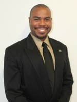 A Georgia wedding DJ in a suit and tie smiling for the camera.