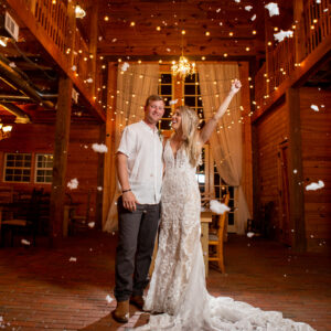 A bride and groom are surrounded by confetti at their wedding, celebrating with a Georgia wedding DJ.
