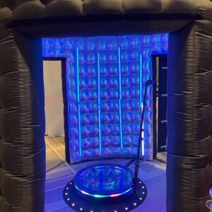 An inflatable room with a blue light in it, perfect for a Georgia wedding DJ setup.