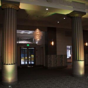 A hallway with pillars, lighting, and a photo booth rental Georgia style.