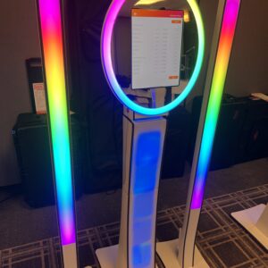 A light stand with a rainbow colored light on it, perfect for Georgia wedding DJ services.
