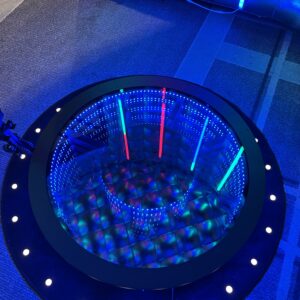 A circular table with blue lights and a Georgia corporate DJ service.
