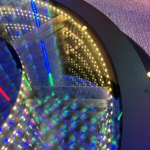 A circular table with colorful lights on it, perfect for a Georgia wedding DJ setup.