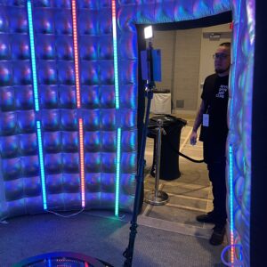 A man standing in front of a photo booth rental Georgia.