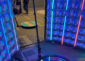 A room with colorful lights and a chair in it, tailored for a Georgia corporate DJ service.